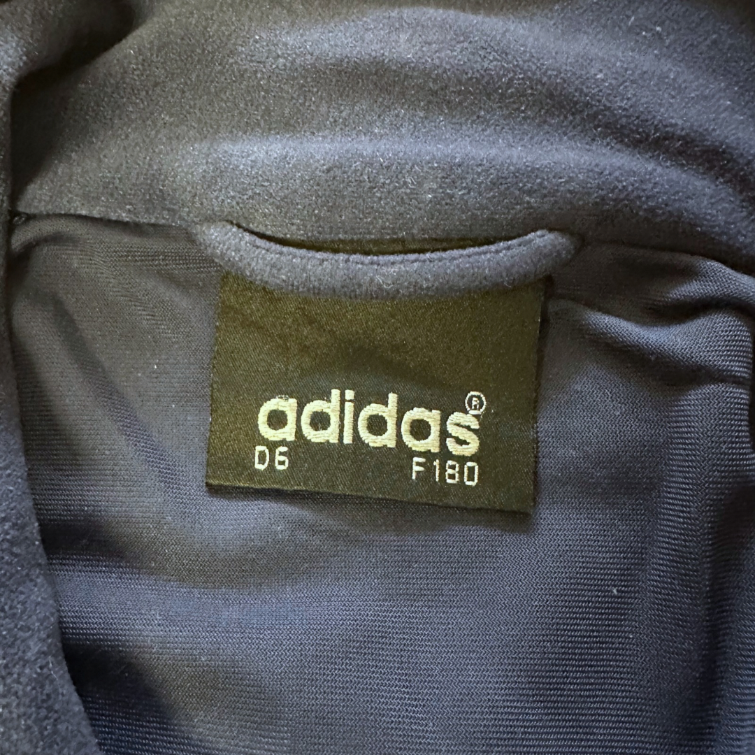 Veste Adidas Vintage “One World” – Années 90