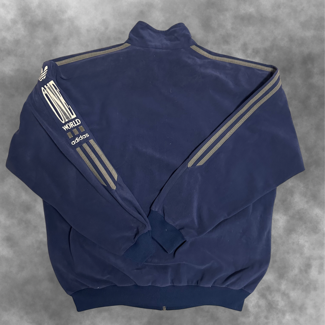 Veste Adidas Vintage “One World” – Années 90
