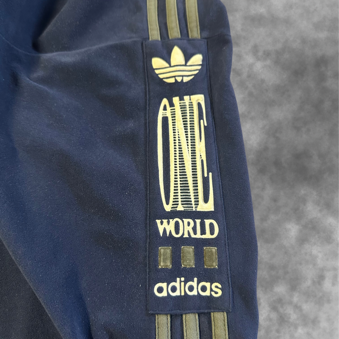 Veste Adidas Vintage “One World” – Années 90