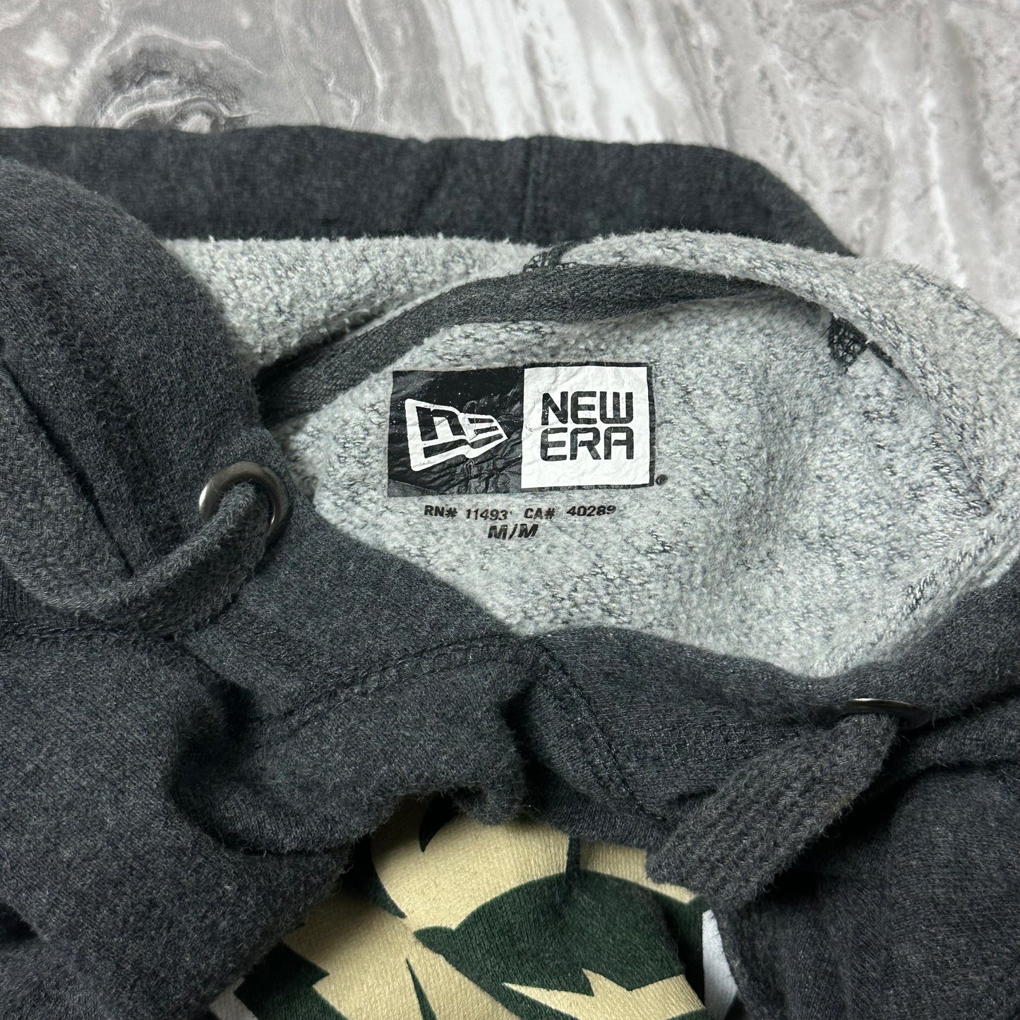 Sweat à capuche New Era Saskatchewan Rattlers – Taille M