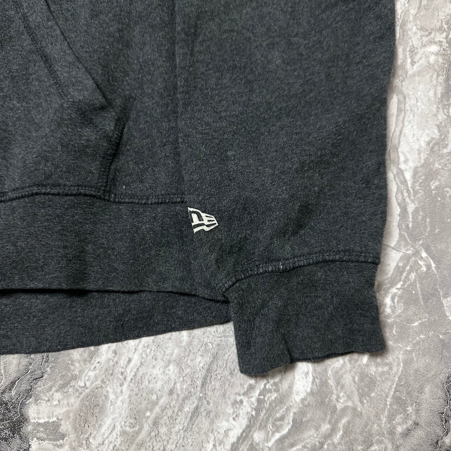 Sweat à capuche New Era Saskatchewan Rattlers – Taille M