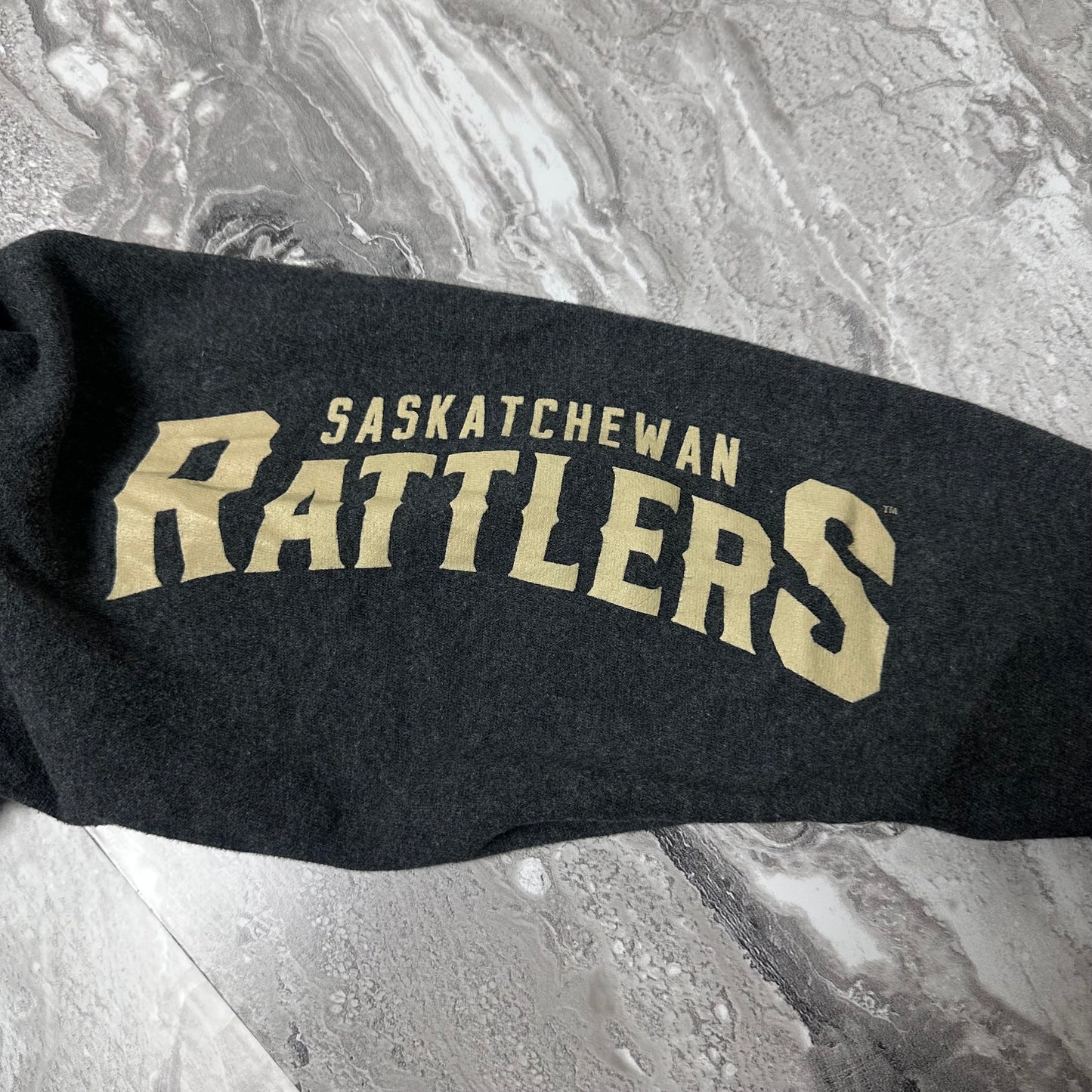 Sweat à capuche New Era Saskatchewan Rattlers – Taille M