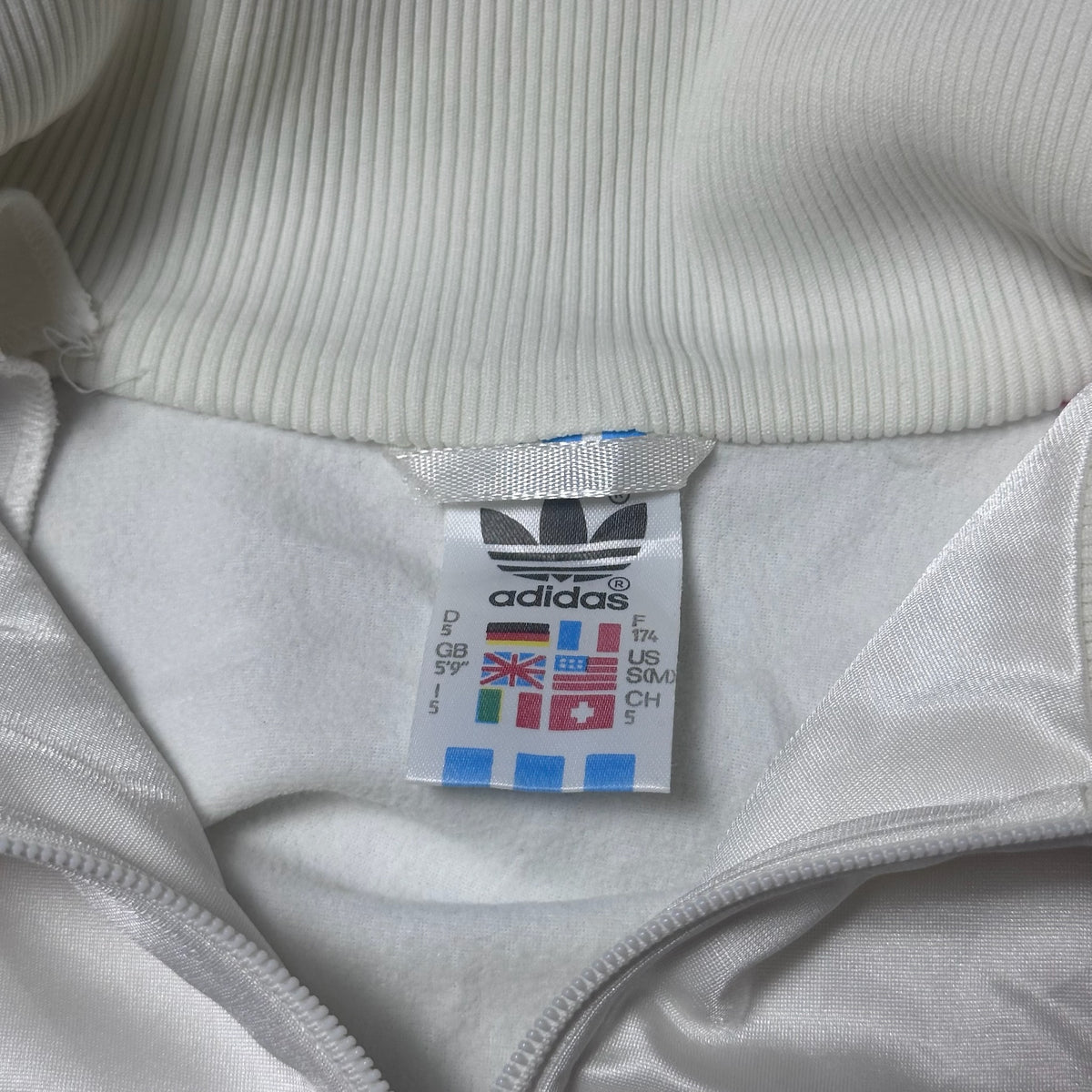 Dos de la veste Adidas blanche multicolore