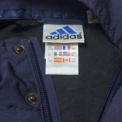 Dos de la veste Adidas golf bleu marine avec col montant
