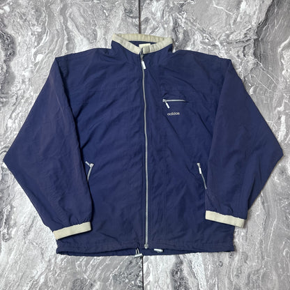 Veste Adidas bleu marine avec fermeture zippée vue de face