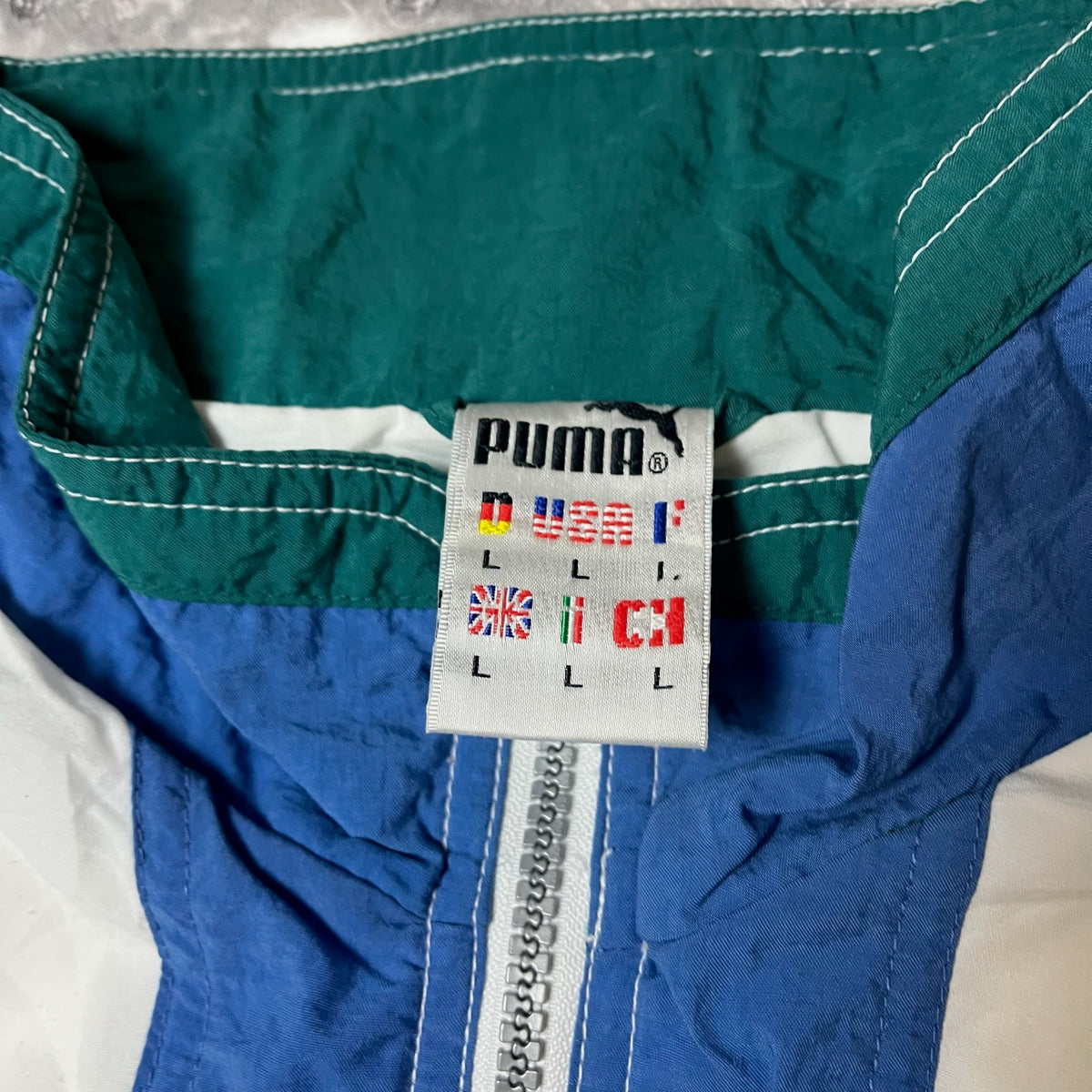 Étiquette de taille Puma indiquant L