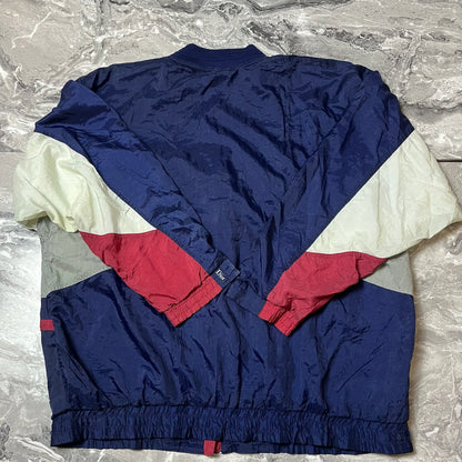 Dos de la veste Christian Dior bleu marine rouge et blanc
