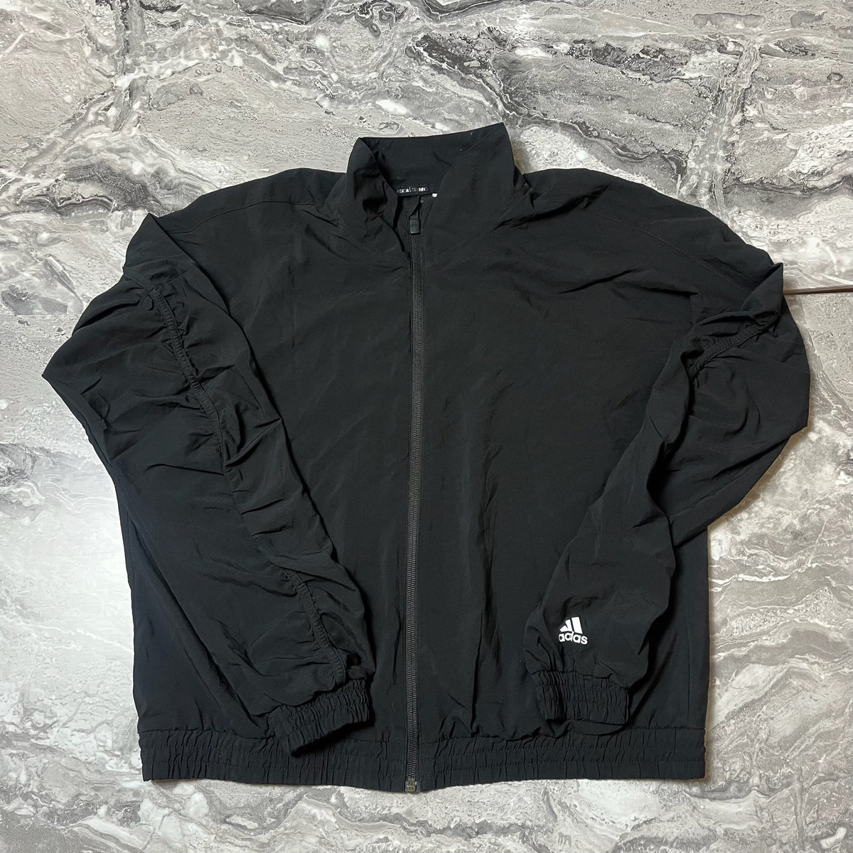 Face avant de la veste Adidas Training noire
